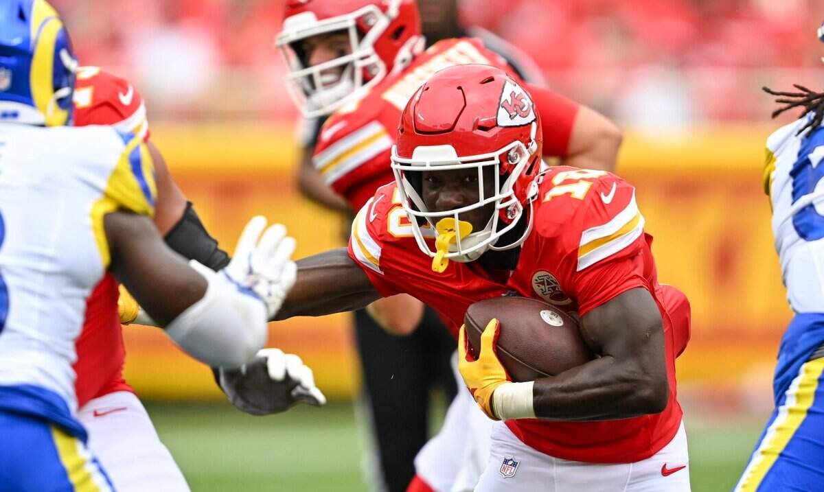 Kansas City Chiefs running back Emmett Johnson (10) pushes a defender off in the second quarter of the Kansas City Chiefs vs. Los Angeles Rams preseason game at Arrowhead Stadium in Kansas City on Aug. 15, 2026.
