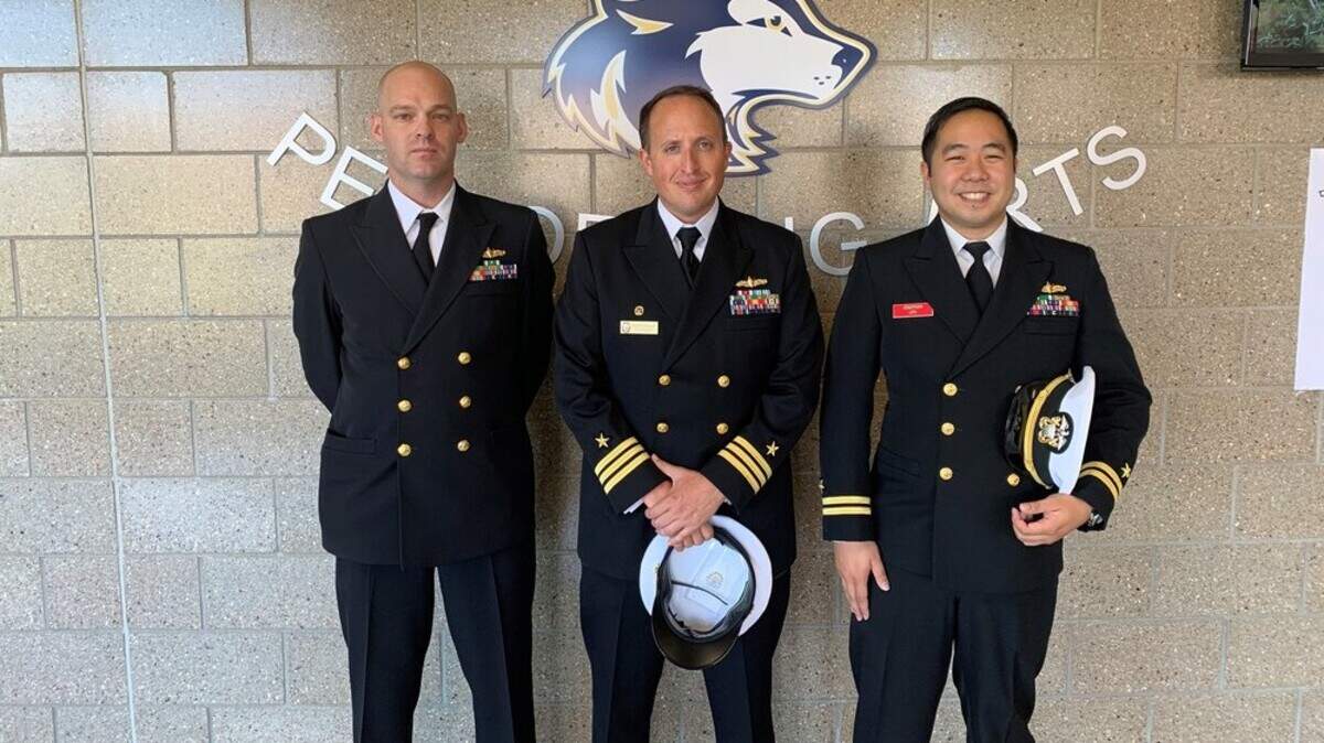 Students at Trail Ridge Middle School learned about the Navy and the USS Kansas City from these three Navy officers.