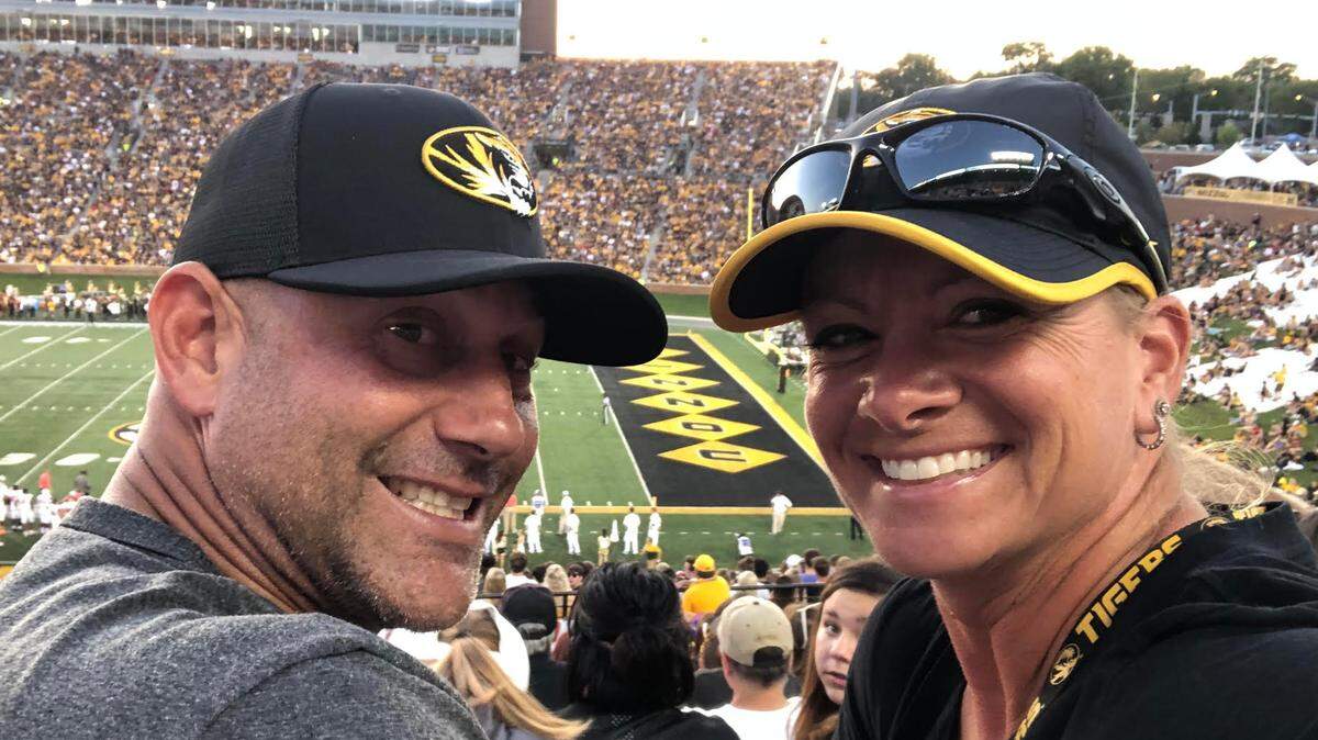 Diamond sports are a mutual passion for husband and wife team of Patrick and Larissa Anderson. The latter is head coach of the Mizzou softball team. This photo was taken at an MU football game.