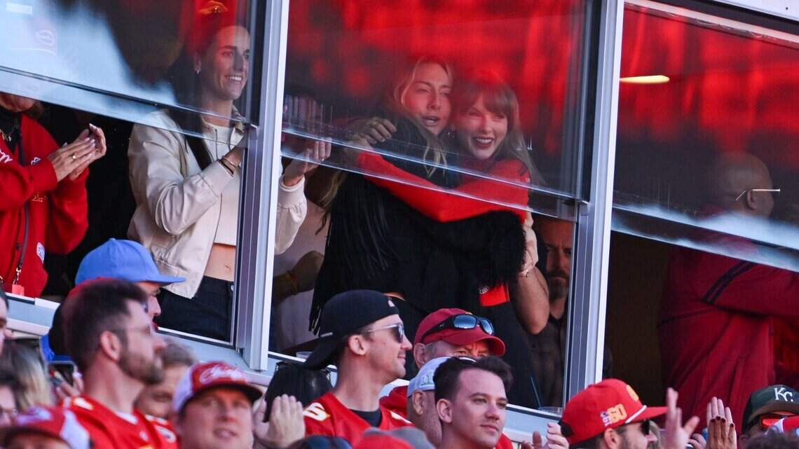 Taylor Swift watches Chiefs defeat Chargers in cozy red Louis Vuitton bodysuit