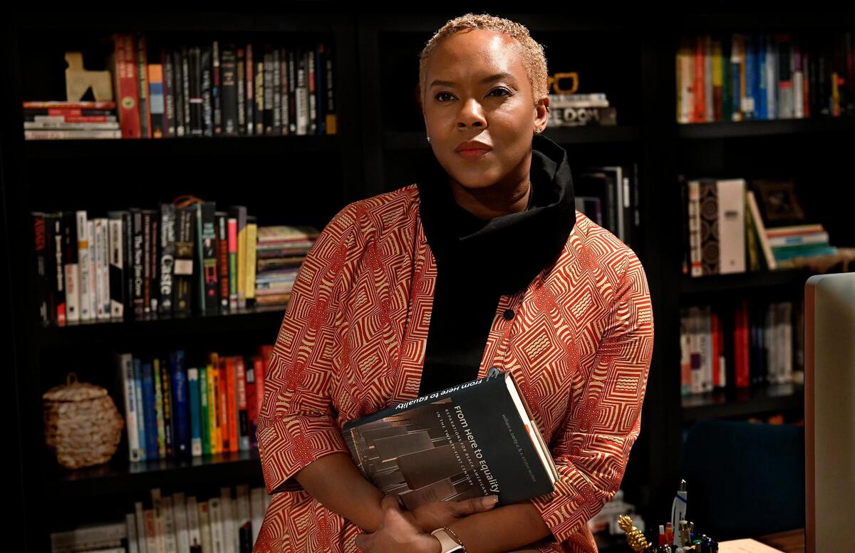 Portrait of Dr. Nicole Price, who has faced racism in Kansas City, particularly as a Black homeowner and parent in the Northland. She has also written numerous books on the Black experience, and she teaches leadership development focused around equity and inclusion.