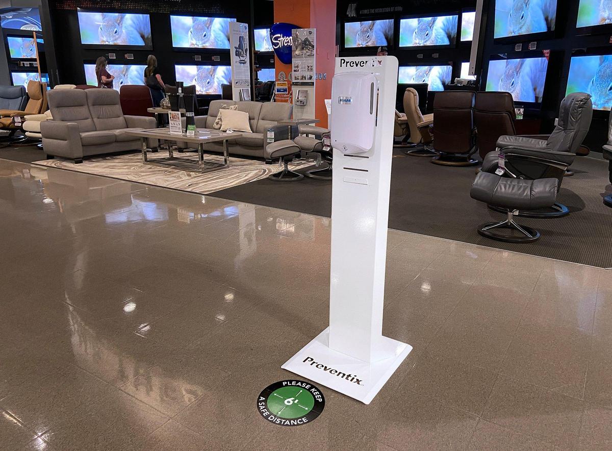 Nebraska Furniture Mart in Kansas City, Kansas, has placed hand sanitizer stations and distance markers throughout the store.