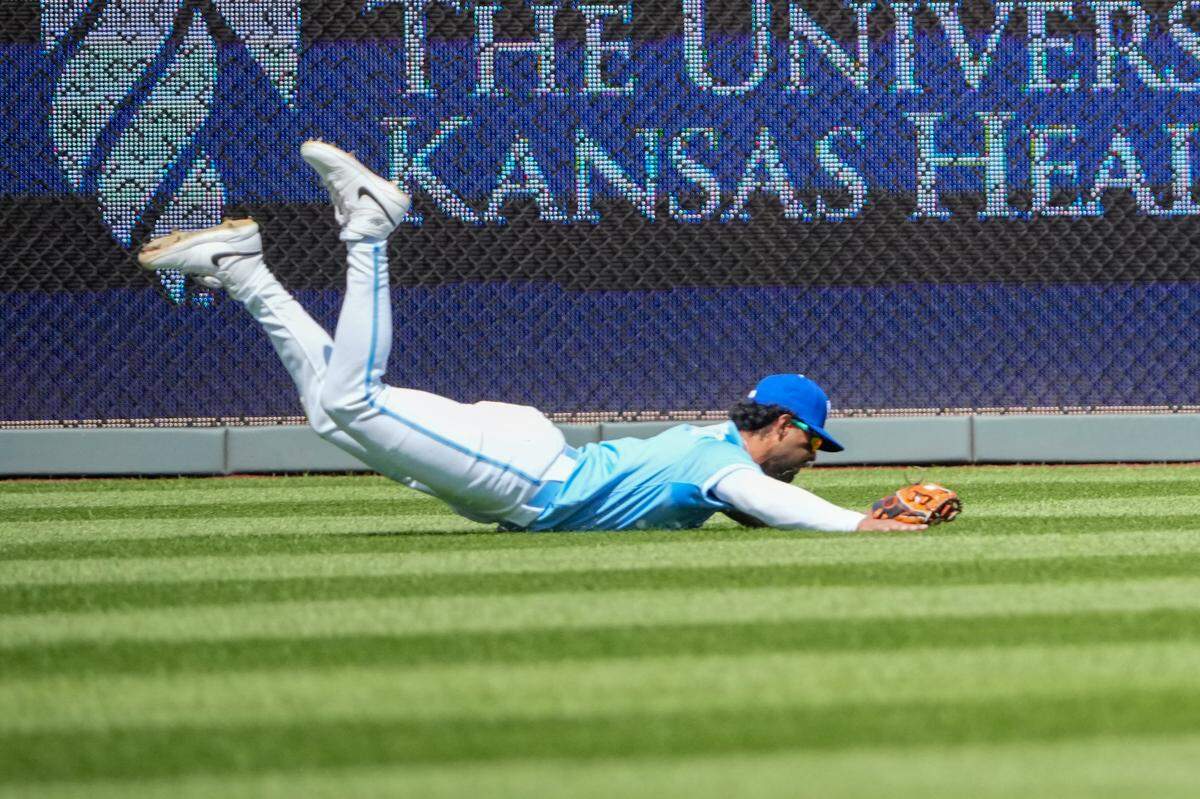 Royals left fielder MJ Melendez makes an athletic diving catch on a long fly ball hit during the fourth inning of a Thursday, April 10, 2025 Major League Baseball game against the Minnesota Twins at Kauffman Stadium in Kansas City.