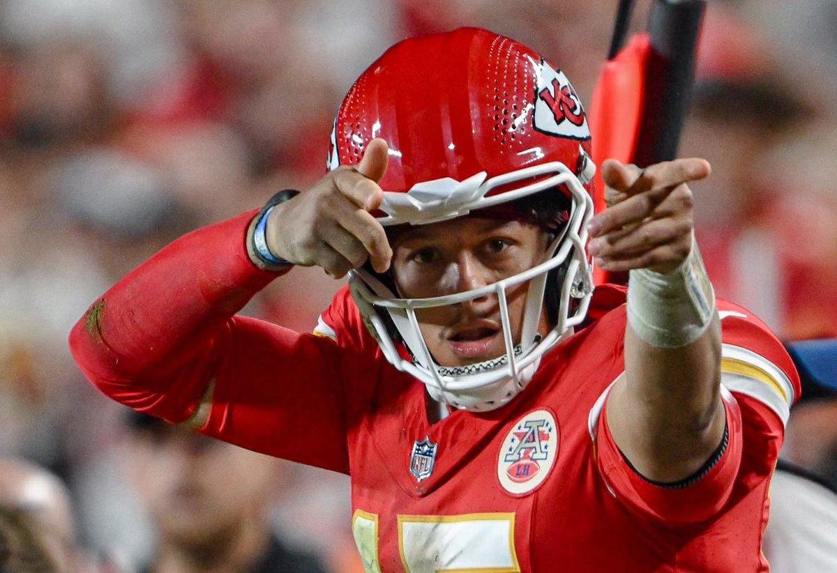 Kansas City Chiefs quarterback Patrick Mahomes (15) signals a first down after he made a diving run for the marker against the New Orleans Saints in the fourth quarter on Monday, Oct. 7, 2024, at GEHA Field at Arrowhead Stadium.