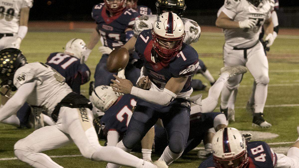 Quarterback Arland Bruce IV of Olathe North carries the ball during Friday night’s Kansas Class 6A victory over Blue Valley at the Olathe District Activity Complex.