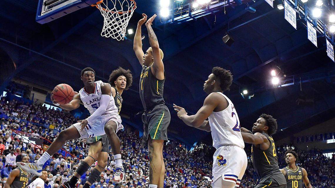 KU’s Jalen Coleman-Lands wrapped a pass around Baylor’s Jeremy Sochan during the second half of a Big 12 Conference game this season at Allen Fieldhouse. KU beat Baylor 83-59.
