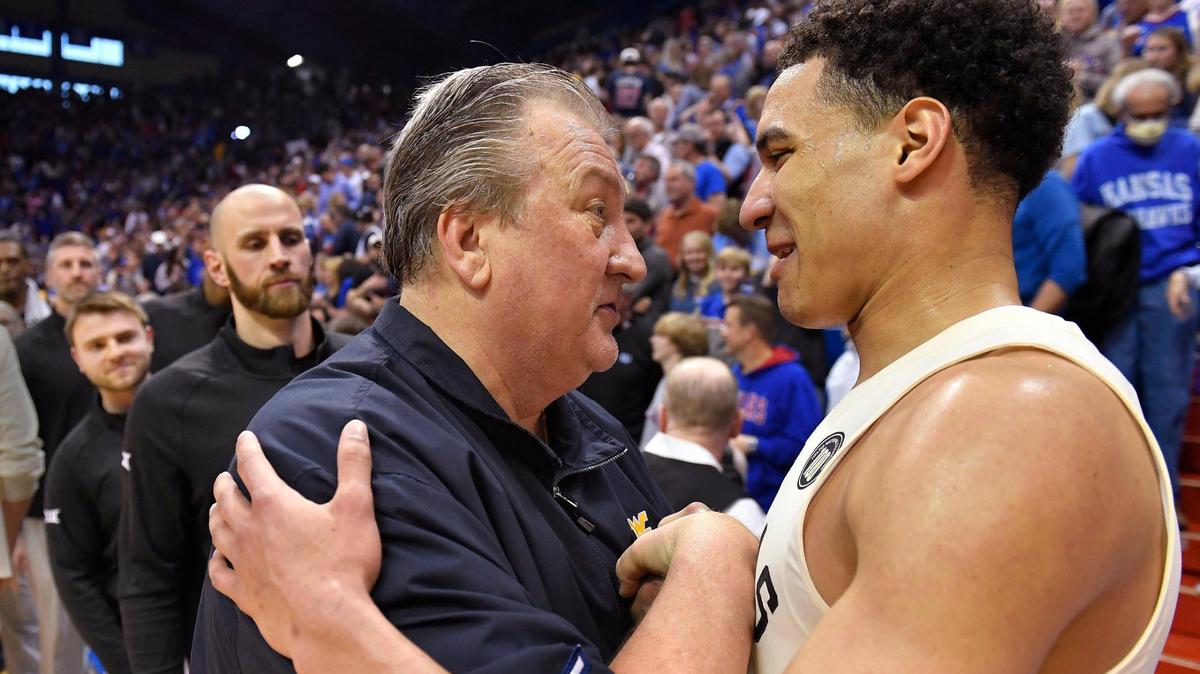 West Virginia coach Bob Huggins, left, congratulates KU’s Kevin McCullar after the Jayhawks beat West Virginia on Feb. 25, 2023, at Allen Fieldhouse.