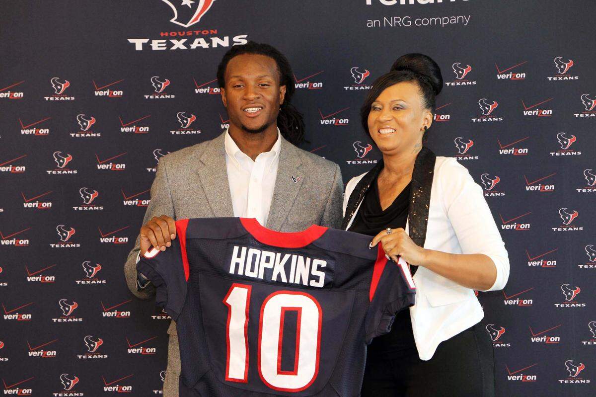 The Houston Texans selected wide receiver DeAndre Hopkins in the first round of the 2013 NFL Draft. Here, he poses for a picture with his mother, Sabrina Greenlee, during an introductory news conference in Houston.