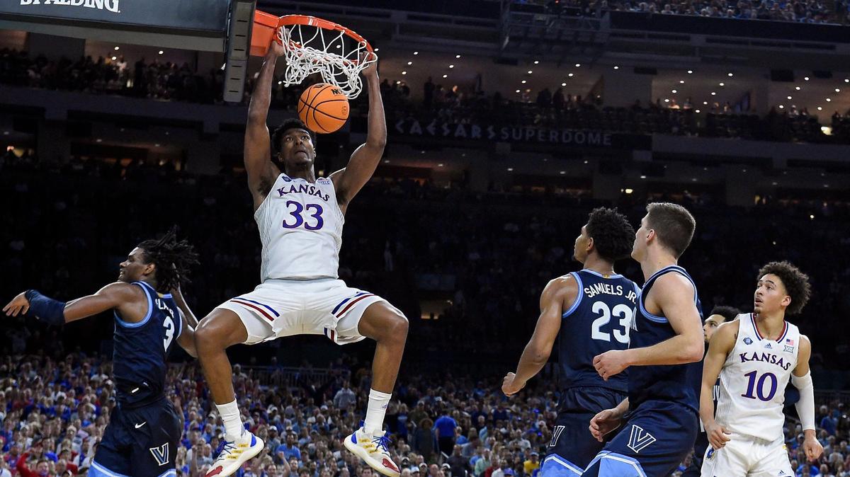 KU’s David McCormack throws down a dunk over Villanova’s Brandon Slater during the second half of Saturday’s NCAA national semifinal at the Final Four at the Superdome in New Orleans. KU breat Villanova, 81-65.
