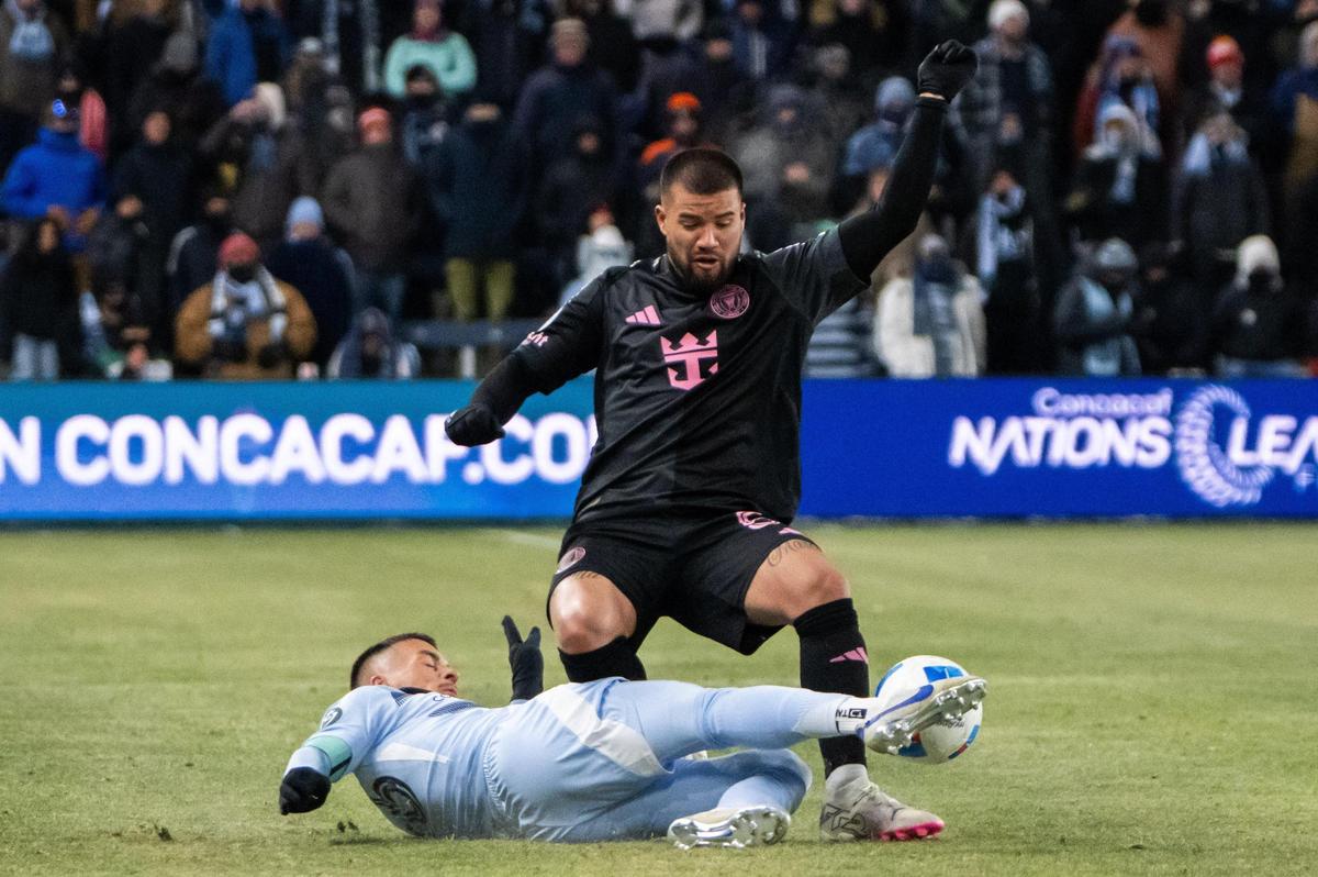 Inter Miami CF defender Tomas Aviles gets the ball tackles from him by a Sporting KC player in the first half of the Concacaf Champions Cup match of Sporting KC vs. Inter Miami CF on Wednesday, Feb. 19, 2025, at Sporting Park.