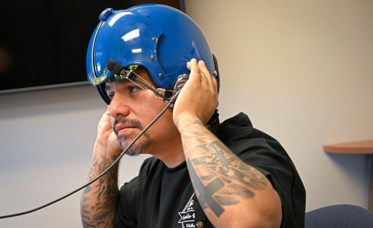 Erik Erazo tried on a flight helmet as he prepared for his flight with the U.S. Navy Blue Angels.
