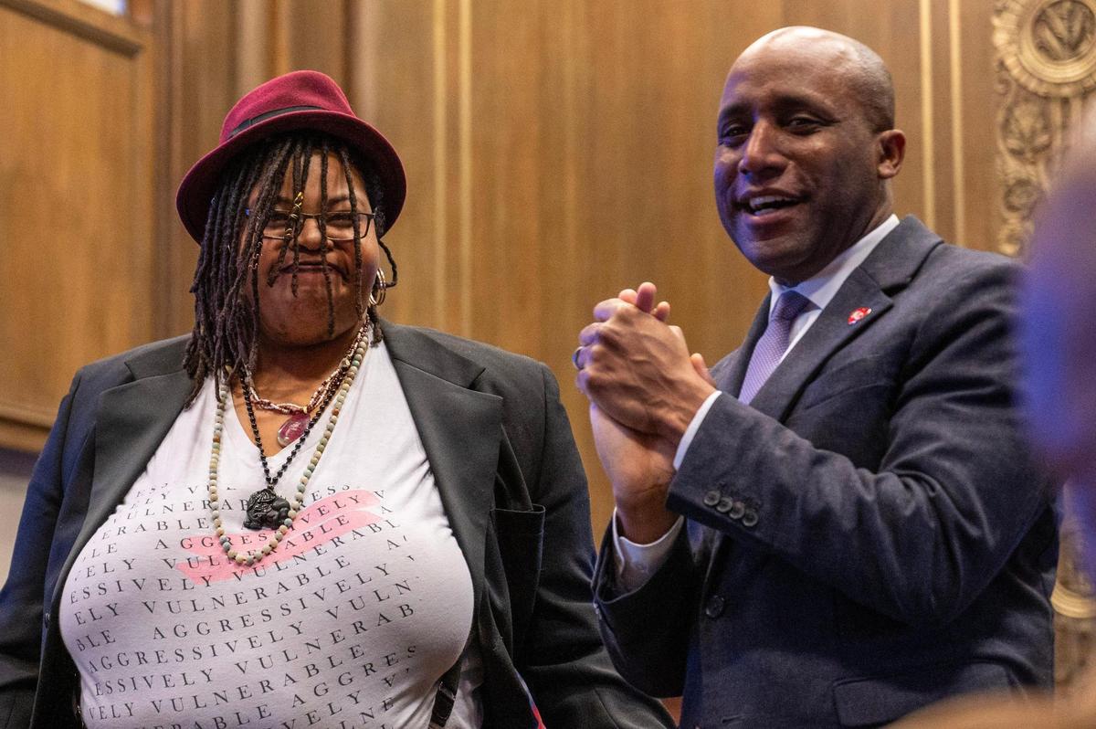 Melissa Ferrer Civil was applauded after reciting a new poem, “Mounting Meditations on the Shoulders of Giants.” Mayor Quinton Lucas introduced her to the crowd.