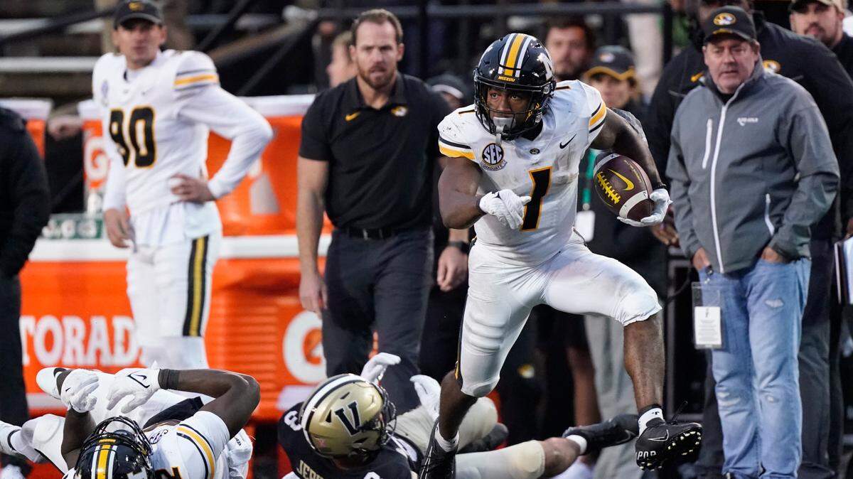 Missouri running back Tyler Badie (1) carries the ball for a 73-yard gain against Vanderbilt in the second half of an NCAA college football game Saturday, Oct. 30, 2021, in Nashville, Tenn. (AP Photo/Mark Humphrey)