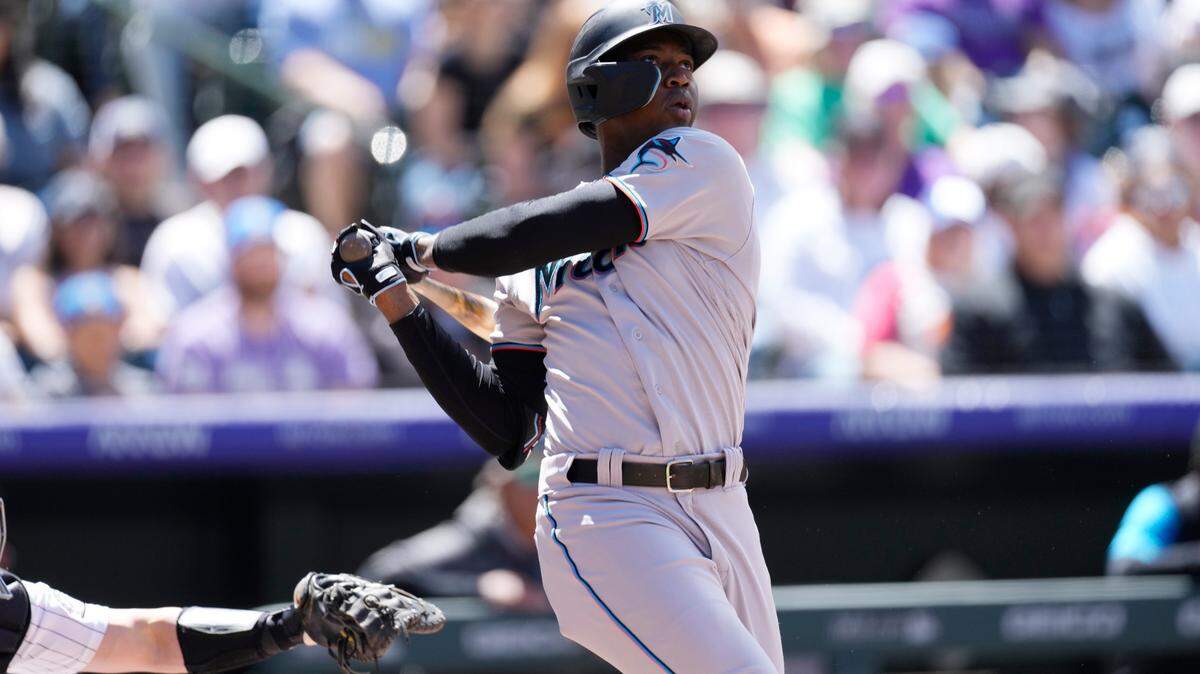 Miami Marlins’ Jesus Sanchez follows the flight of his solo home run off Colorado Rockies starting pitcher Ryan Feltner in the second inning of a baseball game Monday, May 30, 2022, in Denver. (AP Photo/David Zalubowski)