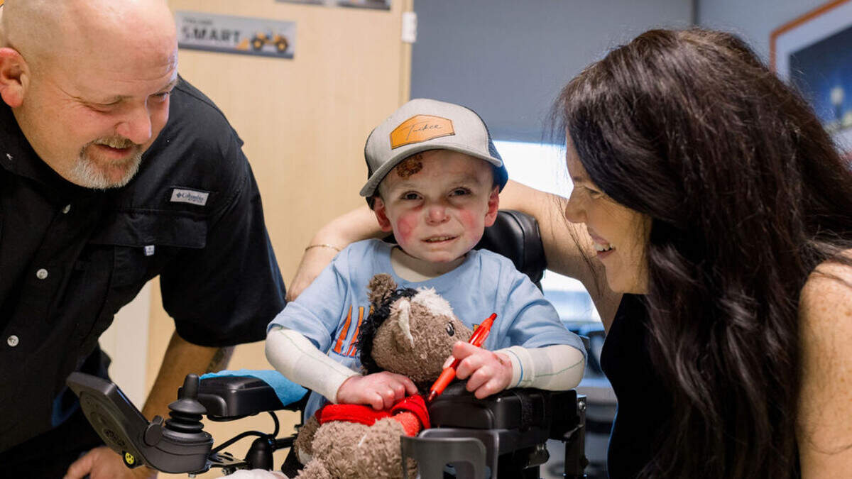 Tucker Langford, 3, is pictured with his grandparents Jon and Keri. Tucker has been battling a skin condition known as ‘butterfly skin’ since birth. He was recently diagnosed with a heart condition and placed on at-home hospice.