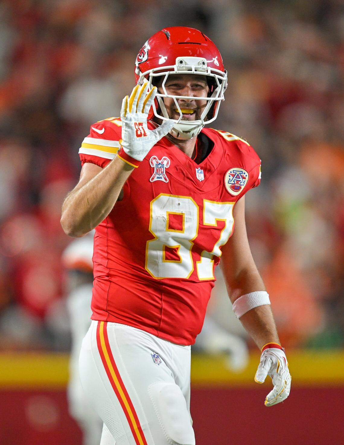 Kansas City Chiefs tight end Travis Kelce (87) waves to the sidelines after making a catch in the first of the game against the Denver Broncos at GEHA Field at Arrowhead Stadium on Thursday, Dec. 25, 2025.
