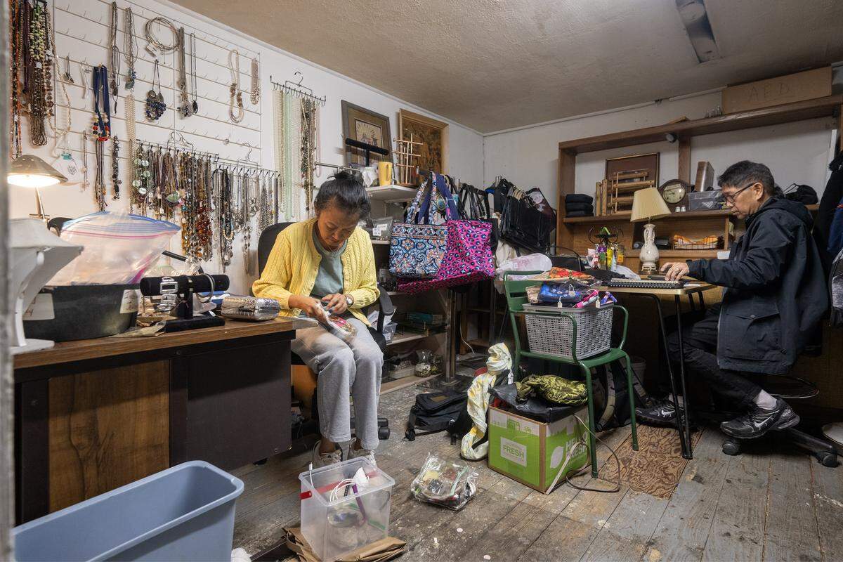 Jo and Ben Babaran, two of the founders/managers of Troost39, a thrift store at 3922 Troost Ave., work in a back room on store business on Thursday, Jan. 22 2026, in Kansas City.