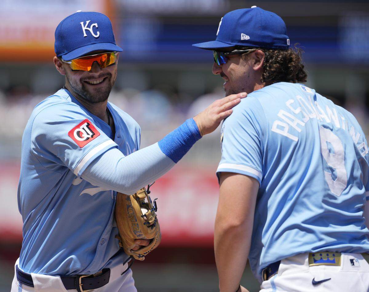 Michael Massey #19 of the Kansas City Royals and Vinnie Pasquantino #9 of the Kansas City Royals react after a double play against the Chicago White Sox in the fourth inning at Kauffman Stadium on May 08, 2025 in Kansas City, Missouri.