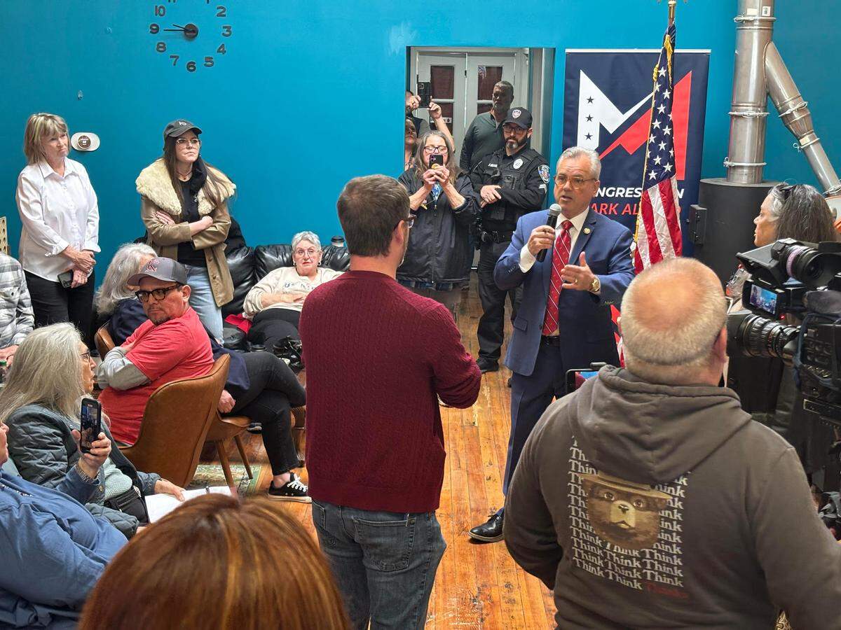 Rep. Mark Alford speaks with Daniel Scharpenburg, 1st vice president at NTEU Chapter 66 in Kansas City, during a town hall event in Belton.