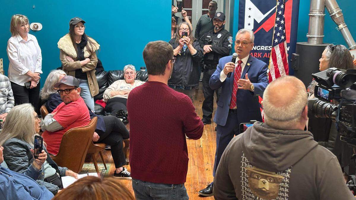 Rep. Mark Alford speaks with Daniel Scharpenburg, 1st vice president at NTEU Chapter 66 in Kansas City, during a town hall event in Belton.