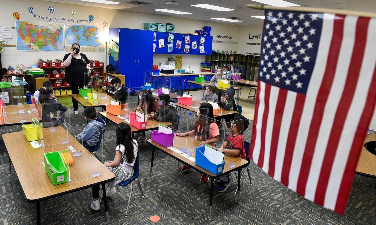 The Kansas City, Kansas, school district was one of the last in the area, and the state, to return to full-time, in-person learning. On the first day, Wednesday, reminders of the coronavirus were all around Douglass Elementary School, including desk partitions in Marion Heck’s first-grade class.