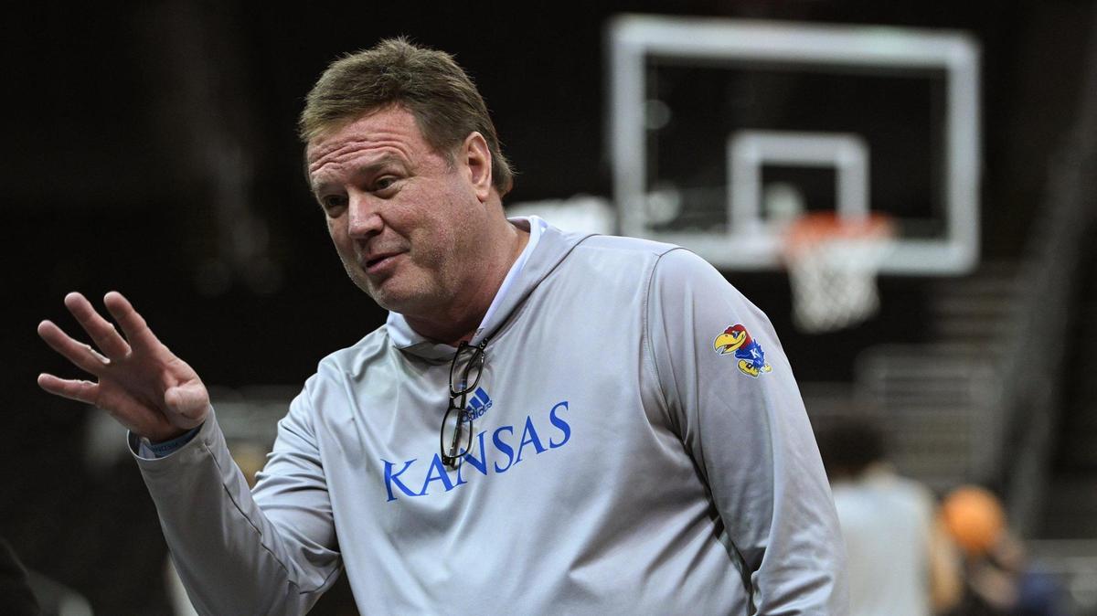 Kansas coach Bill Self talks with a reporter while the Jayhawks took the court for practice at the Big 12 Tournament on Wednesday, March 8, 2023.