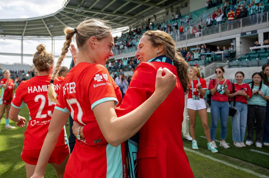 Kansas City Current co-owner Angie Long hugs forward/midfielder Alex Pfeiffer after the Current defeated the Portland Thorns, 5-4, in the home opener at the new CPKC Stadium on Saturday, March 16, 2024, in Kansas City.