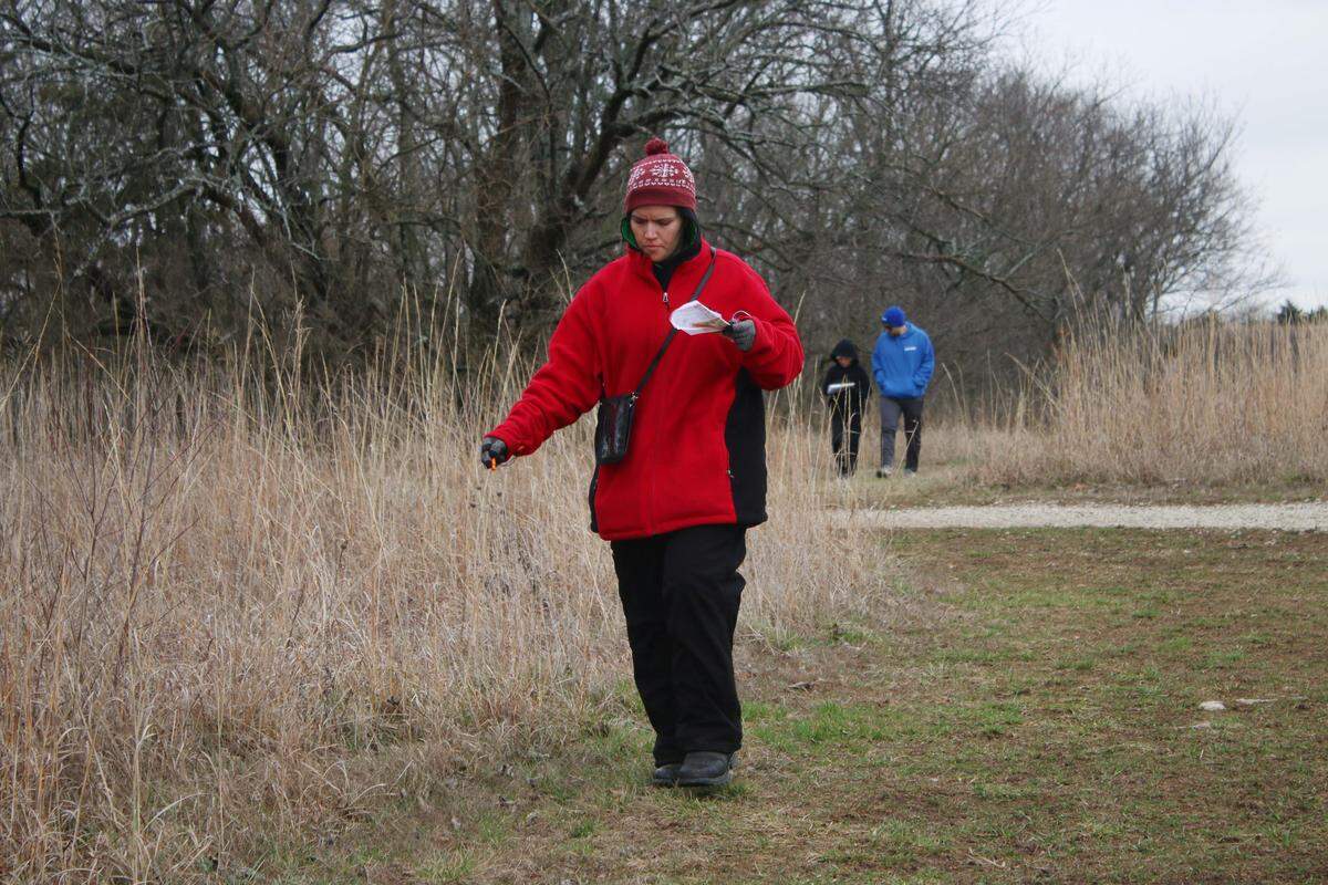 Dawn Lindsay of Maryville finds her way through the Prairie Center preserve in Olathe during a Possum Trot Orienteering Club event.