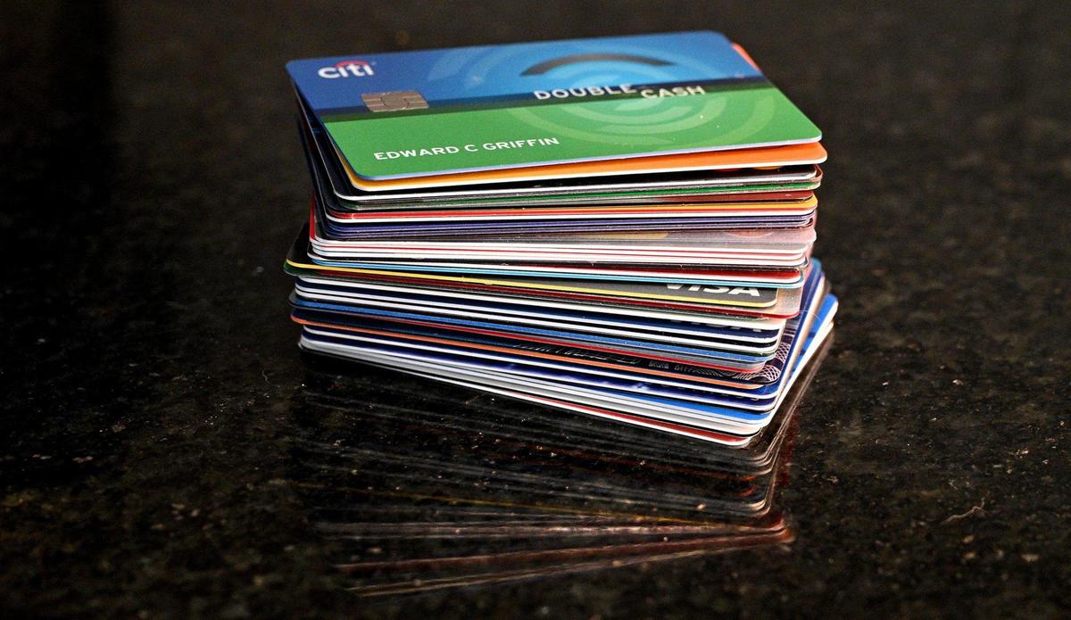A stack of more than three dozen credit cards bear Edward Griffin's name. Griffin told police their mother took the credit cards out without their permission and racked up thousands of dollars in debt. 