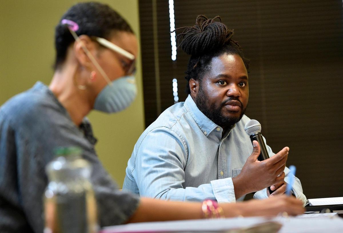 Joseph “Joey Cuts” Thomas is the only business owner on the 18th & Vine Development Policy Committee. Residents and business owners in the historic 18th & Vine Jazz District addressed security in the aftermath of a series of fatal shootings in the neighborhood at a meeting Tuesday, June 23, 2020. The most recent death occurred after Juneteenth celebrations. Attendees overflowed into another room downstairs from the meeting room in the Black Archives of Mid-America building.