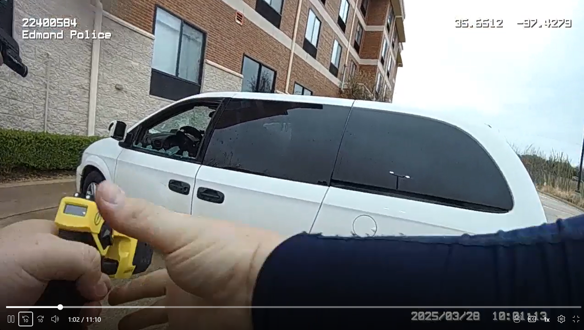 An officer prepares to use a Taser.
