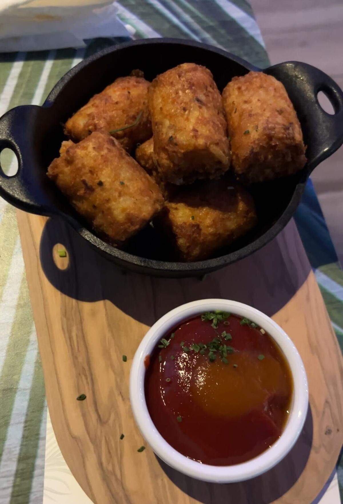 Potato kegs: six giant tater tots filled with cheese, bacon, green onion with habanero ketchup on the side. It’s on the menu at The Frosted Reef, the holiday pop-up bar inside LandShark Bar & Grill, 1491 N 98th Terrace in Kansas City, Kansas.