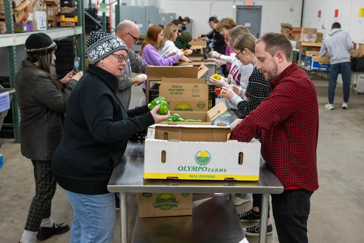 Volunteers from Church of the Resurrection, sorted produce at Knabe’s Market on during a Day of Service to honor the legacy of Dr. Martin Luther King Jr., on Monday, Jan. 20, 2025, in Kansas City.