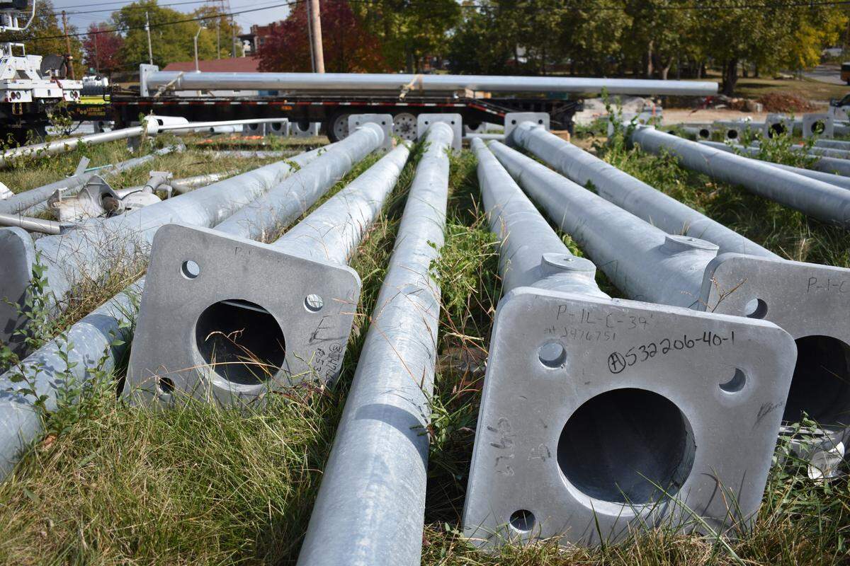 Metal catenary poles are seen at the Capital Electric worksite at the corner of 33rd Street and Southwest Trafficway on Monday, October 23, 2023.