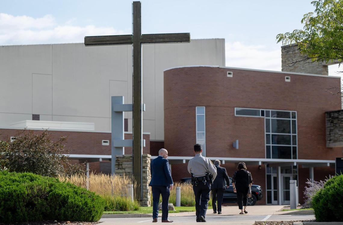 People walk toward the Westside Family Church where a visitation took place for fallen Fairway police officer Jonah Oswald on Sunday, Aug. 13, 2023, in Lenexa, Kan.