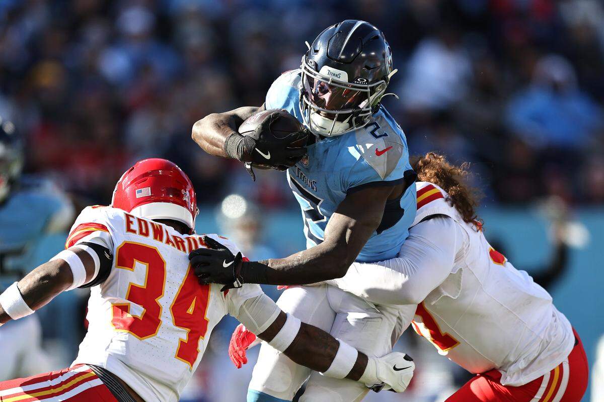 The Kansas City Chiefs’ defense stops Titans running back Tyjae Spears during an NFL Week 16 game at Nissan Stadium in Nashville, Tennessee on Sunday, Dec. 21, 2025.