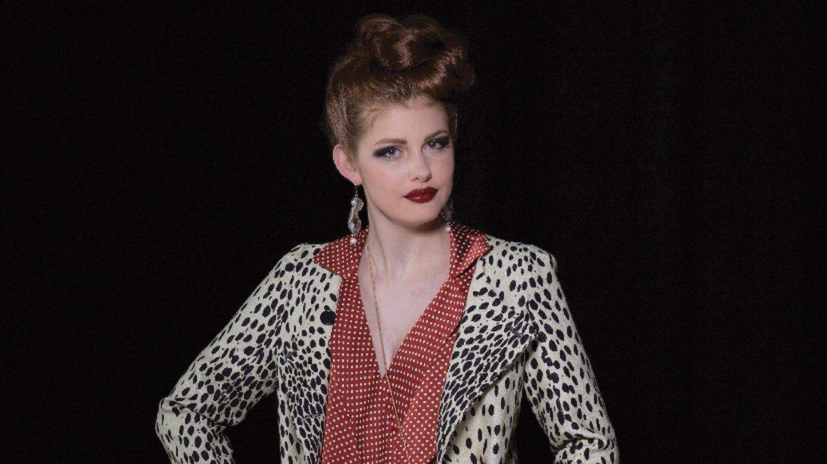 Emerson Fry London leopard print jacket, $382, Anaphora at Prairiefire; long-sleeve polka dot blouse, $78, Halls of Kansas City; silver grid pants, $140, and Jet Couture Jewels geode drop earrings, $150, both from Webster House; Mary Frances’ Oh Honey beaded crossbody cell phone bag, $85, EJ’s Boutique.