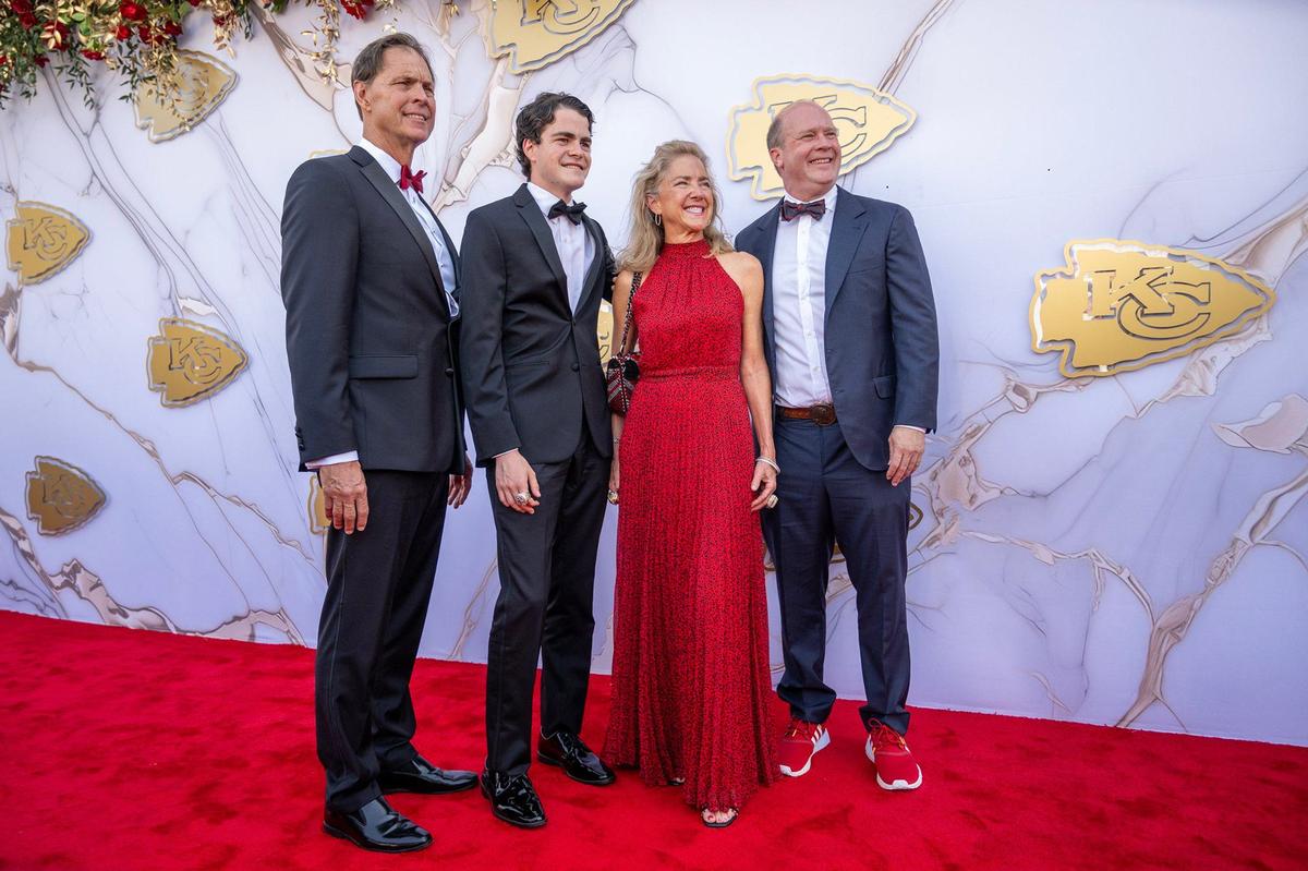 Sharron Hunt and Dan Hunt, right, and family members on the red carpet before the Super Bowl LVIII championship ring presentation event.