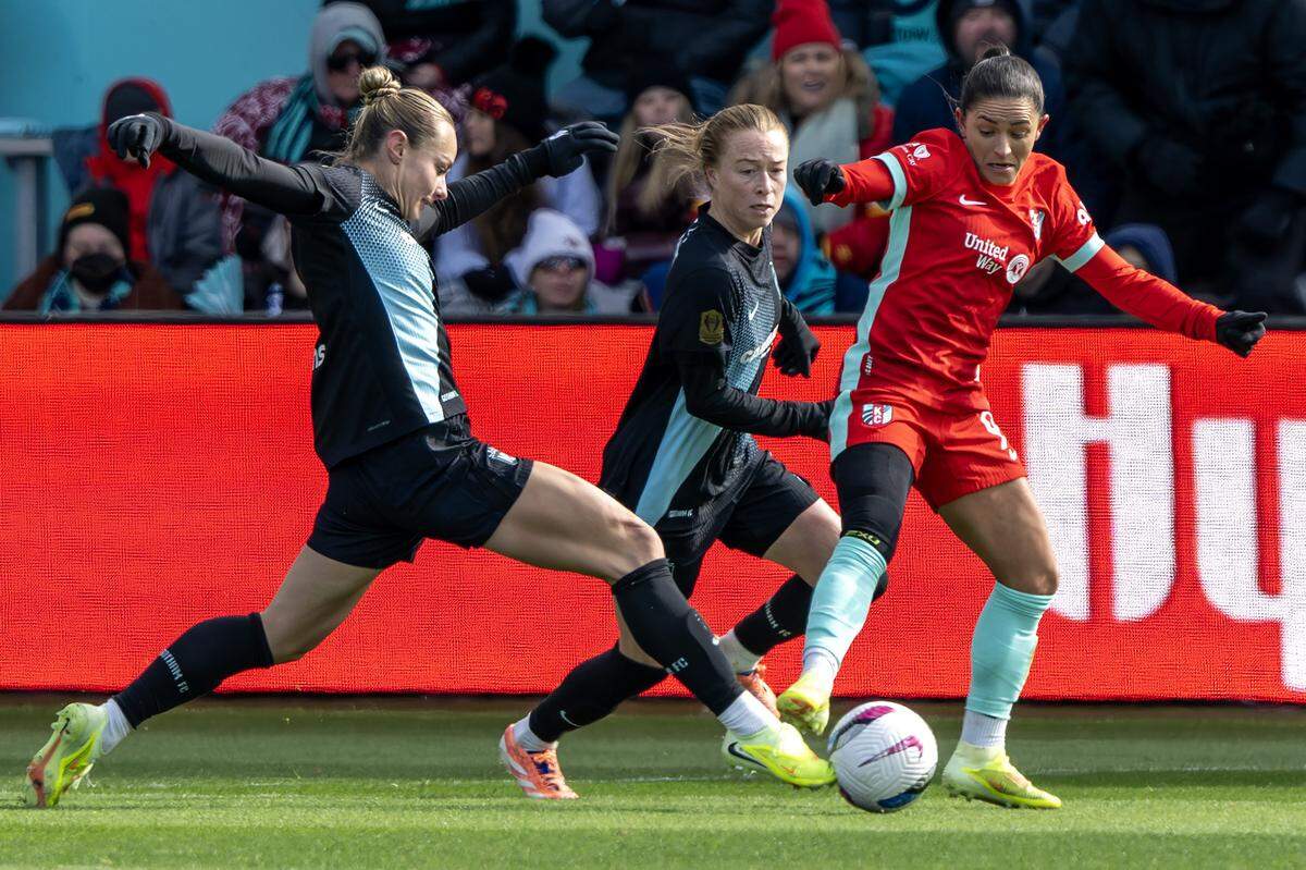 KC Current midfielder Debinha, right, competes Gotham FC midfielder Jaelin Howell for possession during an NWSL playoff match at CPKC Stadium in Kansas City on Sunday, Nov. 9, 2025.