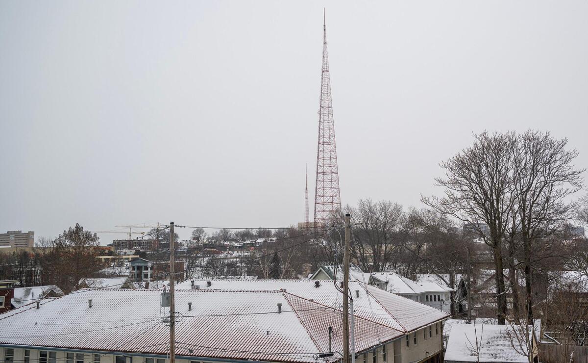 A blanket of fresh snow covers rooftops, with the KCTV Tower visible in the distance on Tuesday, Feb. 18, 2025, in Kansas City