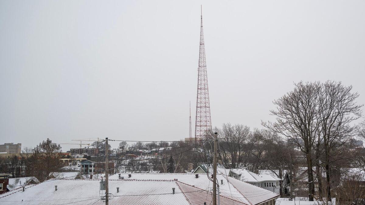 A blanket of fresh snow covers rooftops, with the KCTV Tower visible in the distance on Tuesday, Feb. 18, 2025, in Kansas City.