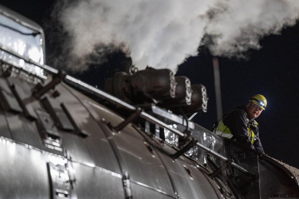 A train technician keeps watch while other technicians perform maintenance on Union Pacific’s Big Boy in Kansas City on Tuesday, Oct. 15, 2024.
