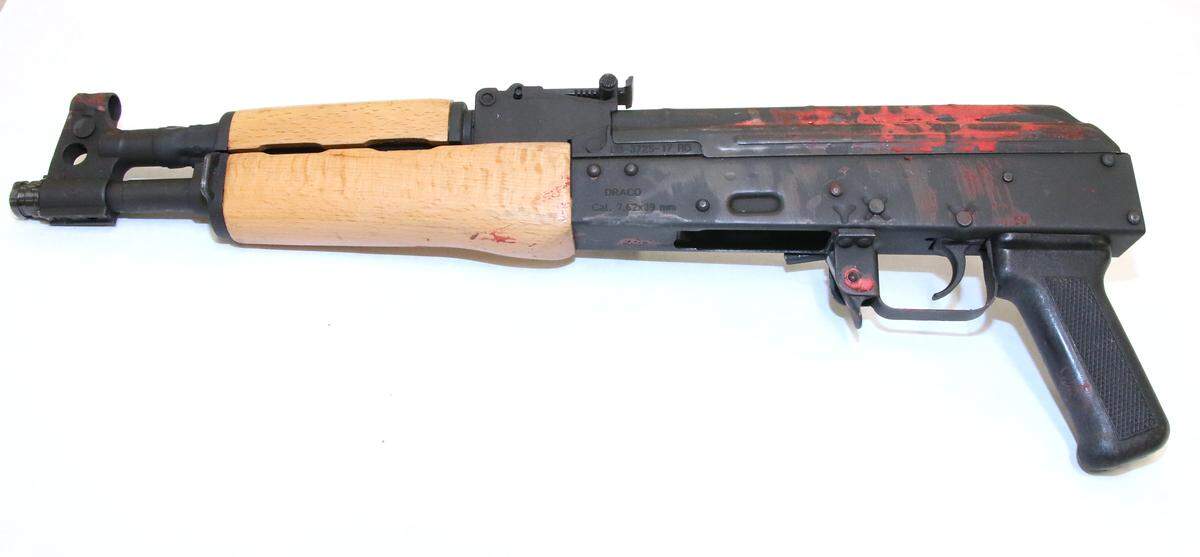 After a disagreement with people waiting to get into 9ine Ultra Lounge, Jahron Swift, a 29-year-old Kansas City man, went to the parking lot and returned with a 9mm handgun and a Drako AK-style rifle, shown here in a police evidence photo.  He fired into the crowd, killing one and injuring 16 before being killed by a security guard.