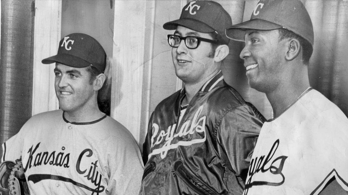 Attired in their new Royal Uniforms are left to right: Catcher Dennis Paepke, pitcher Roger Nelson and outfielder-infielder Bob Oliver. These players modeled the uniforms at a breakfast this morning at the Hotel Continental. Paepke was obtained in a trade from the California Angels for Hoyt Wilhelm, veteran relief hurler; Nelson was the No. 1 Royals’ expansion draft choice and Oliver was chosen in the second round. January 20 1969