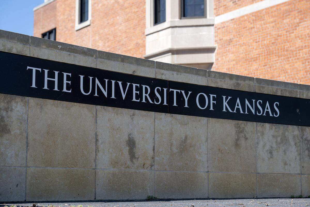 A sign for the University of Kansas is seen near Ascher Plaza at the University of Kansas campus on Monday, April 6, 2026, in Lawrence.