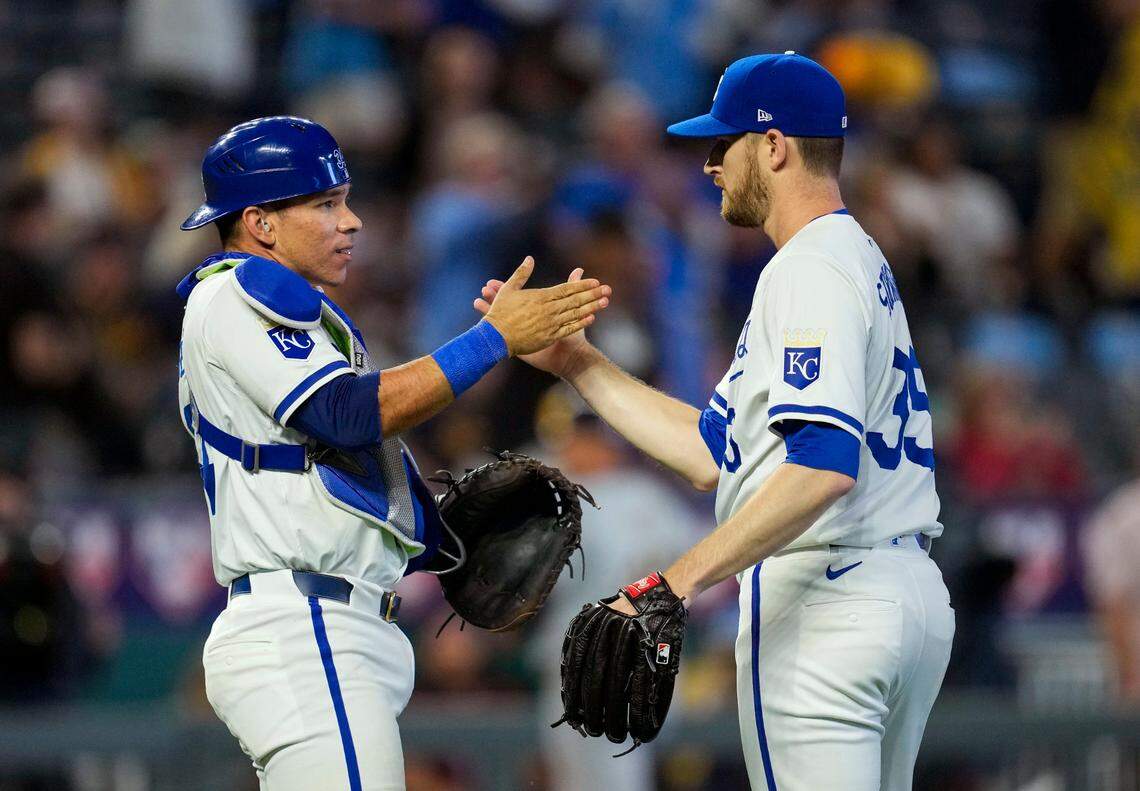Kansas City Royals catcher Freddy Fermin, left, celebrates with pitcher Chris Stratton after a series-opening defeat of the Milwaukee Brewers at Kauffman Stadium in the 2024 season. Stratton earned the save.