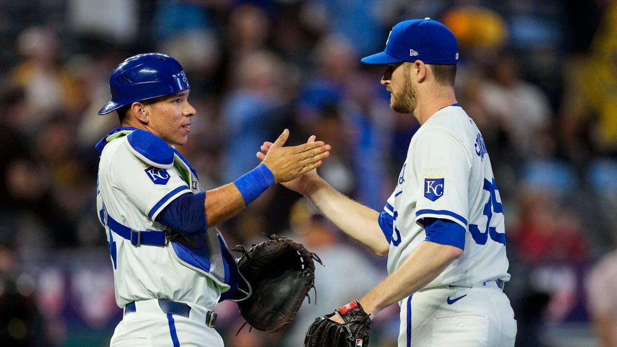 Kansas City Royals catcher Freddy Fermin, left, celebrates with pitcher Chris Stratton after a series-opening defeat of the Milwaukee Brewers at Kauffman Stadium. Stratton earned the save.