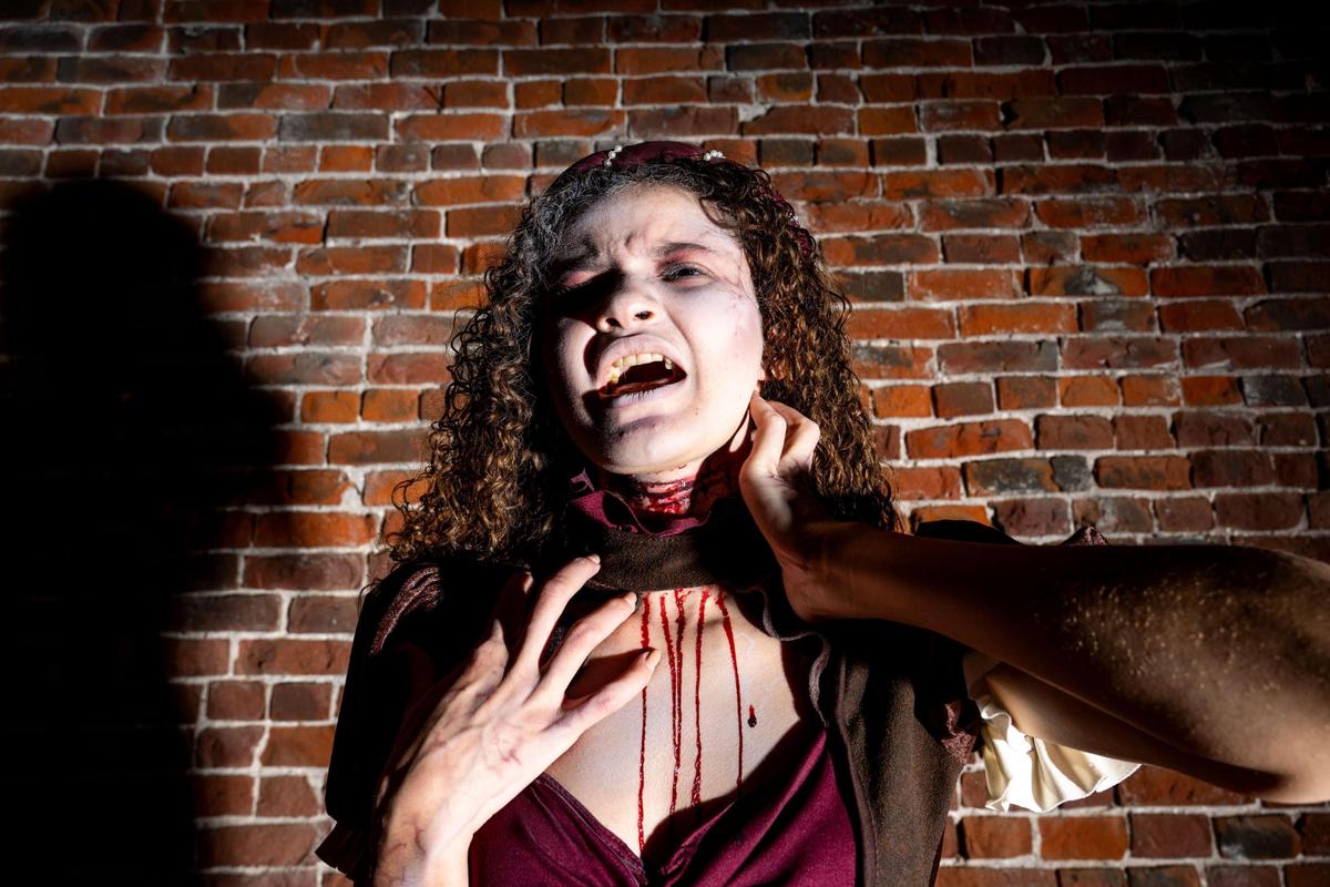 PUB WENCH - Wild, tangled hair and a slashed throat, the pub wench slinks between shadowy tables at The Beast in Kansas City.