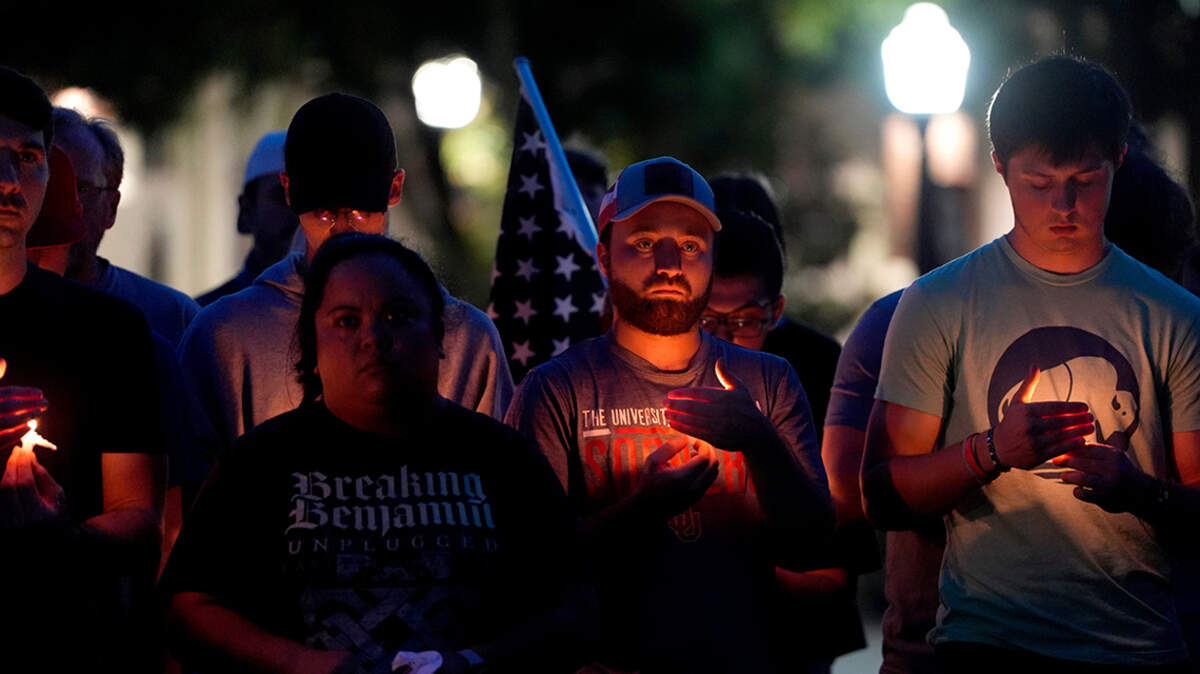 People gather for a vigil in honor of Charlie Kirk at the University of Oklahoma in Norman.