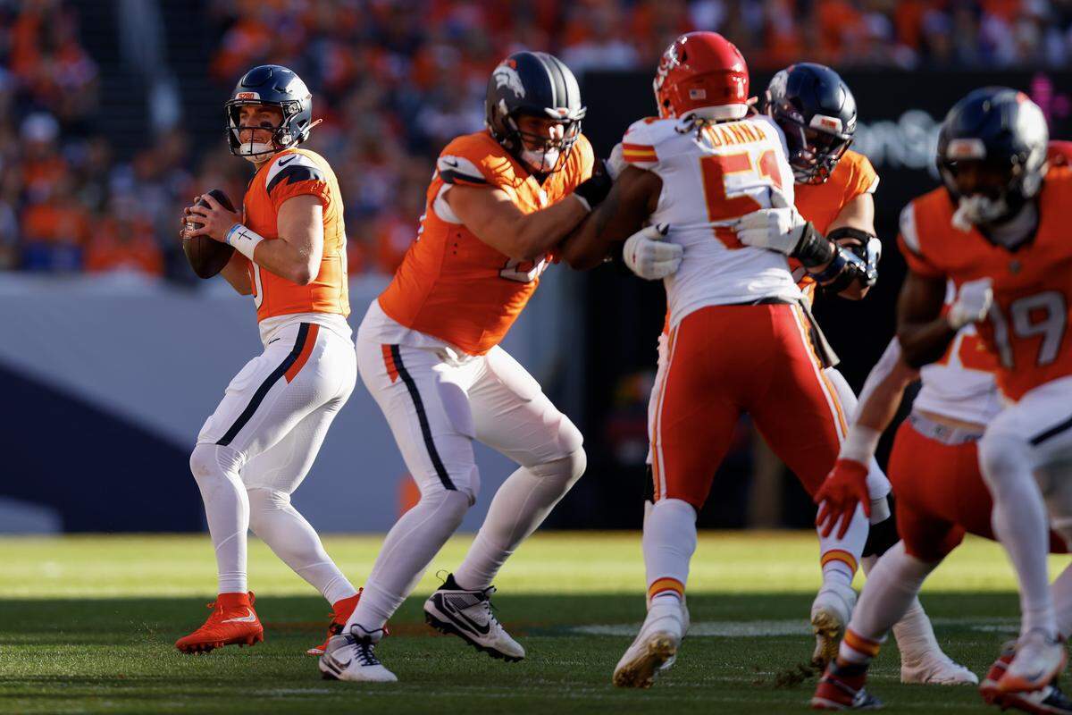 Broncos quarterback Bo Nix, left, looks to pass during an NFL Week 11 game against the Kansas City Chiefs at Empower Field At Mile High in Denver on Sunday, Nov. 16, 2025.